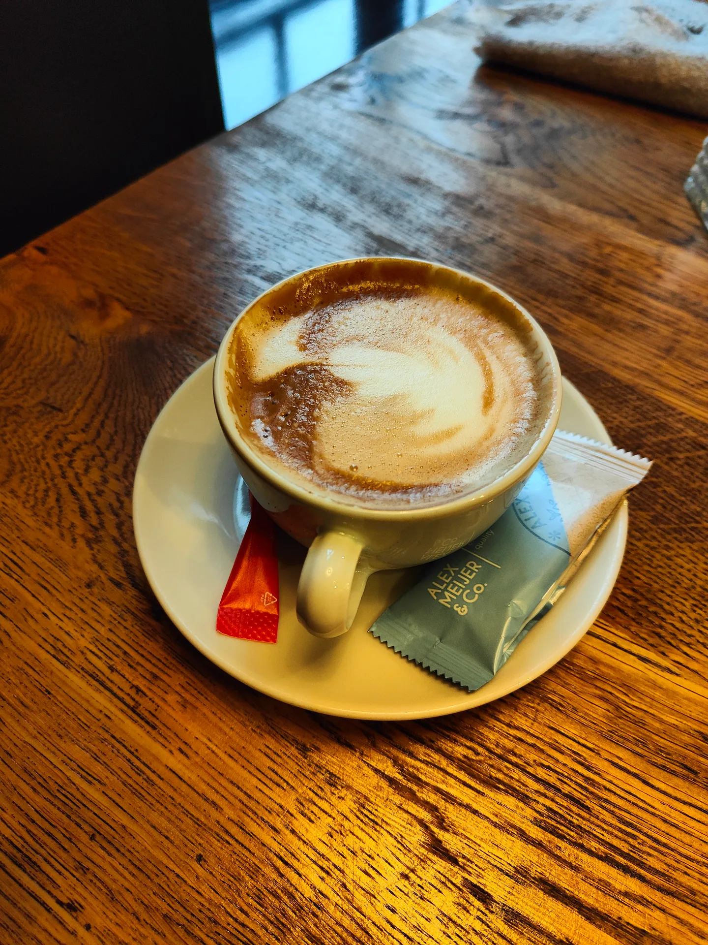 a latte, a window, and the wet market going home