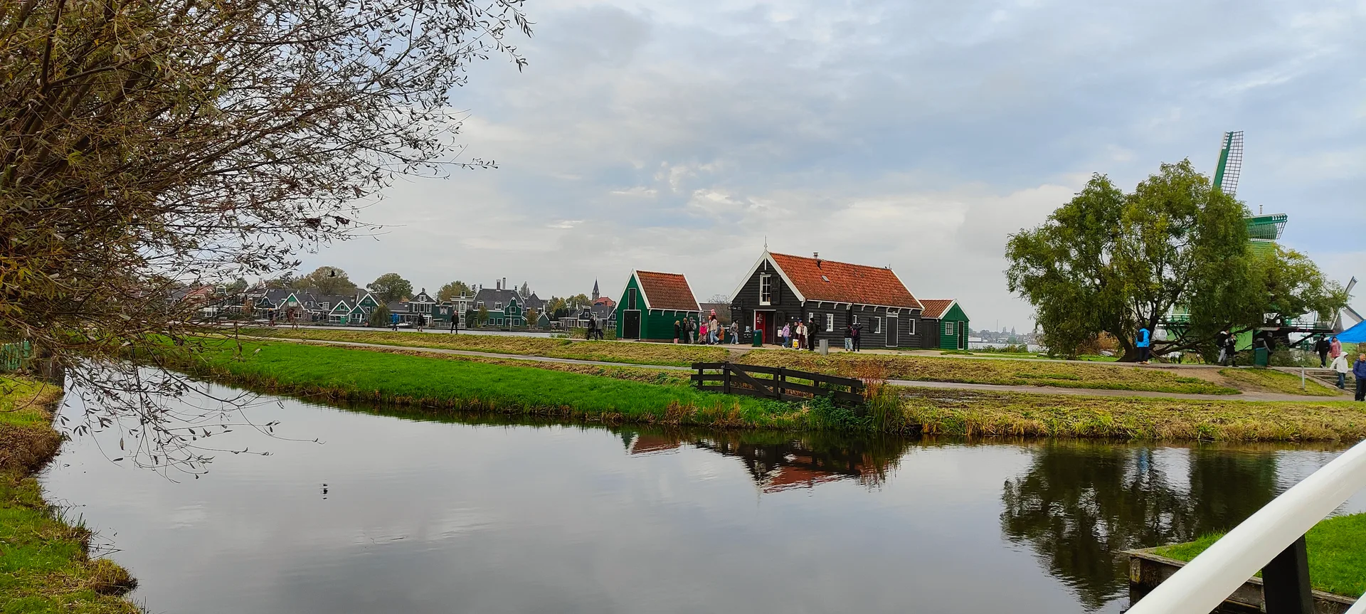 the red-roofed farm across the water