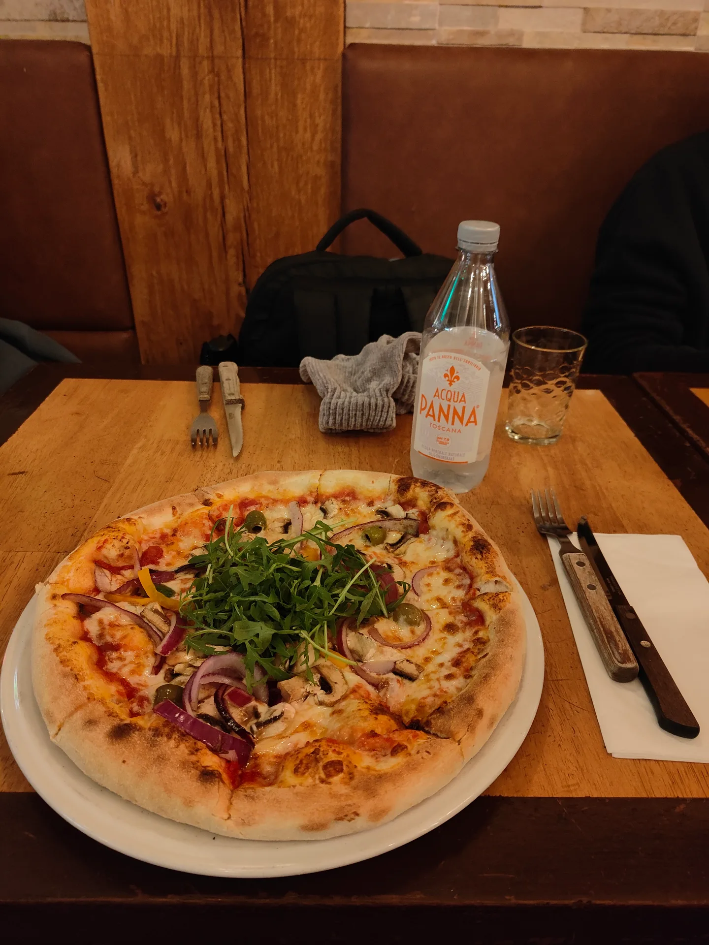 a rocket pizza and acqua panna on lange niezel